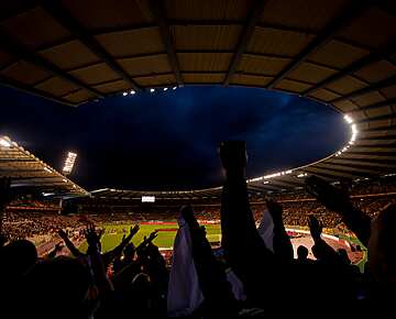 Sports crowd, cheering at the football