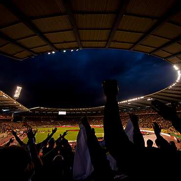 Sports crowd, cheering at the football