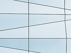 a white and blue wall with black lines