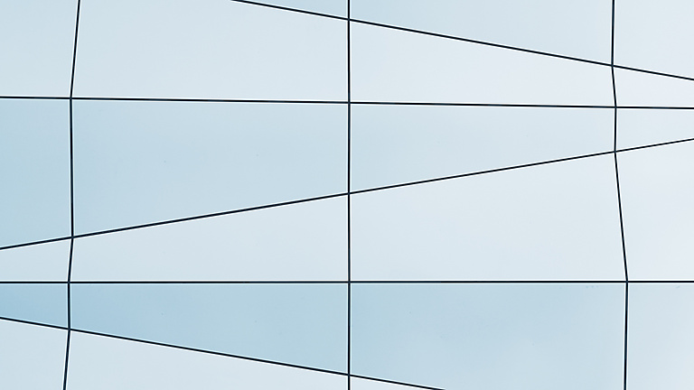 a white and blue wall with black lines