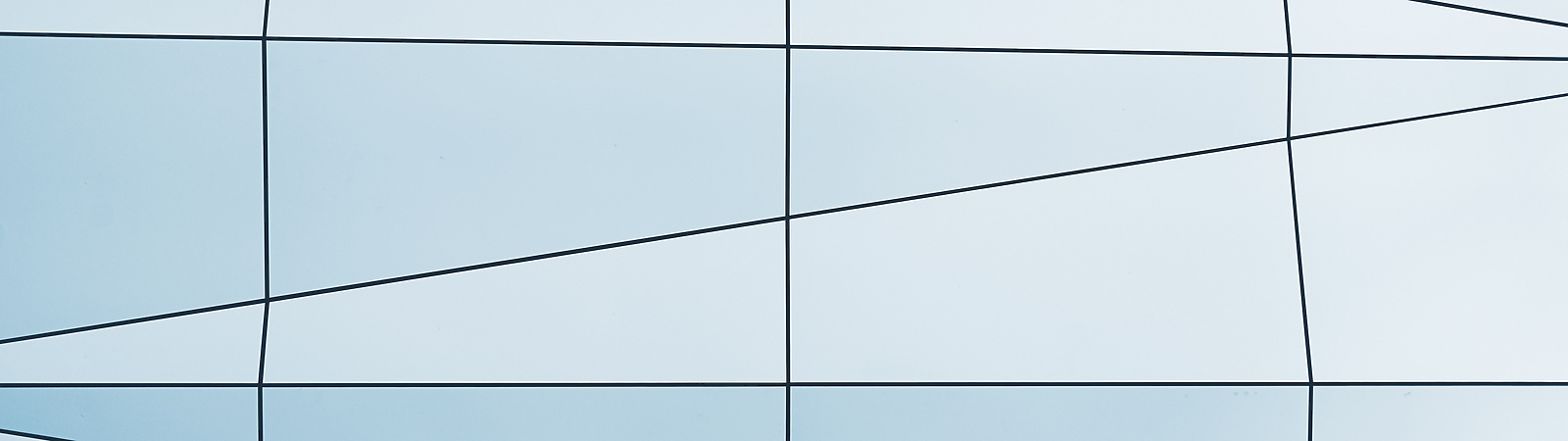 a white and blue wall with black lines