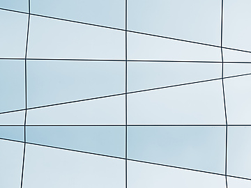 a white and blue wall with black lines