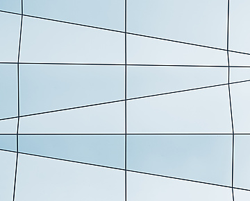 a white and blue wall with black lines