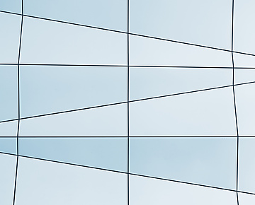 a white and blue wall with black lines