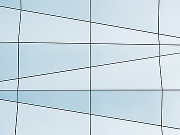 a white and blue wall with black lines