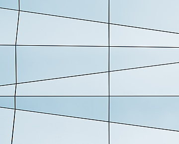 a white and blue wall with black lines