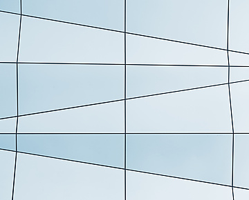 a white and blue wall with black lines