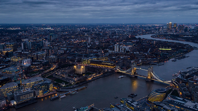 a city with a bridge and a river