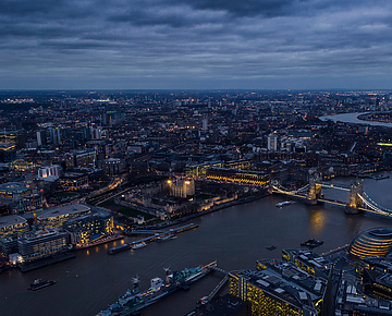a city with a bridge and a river