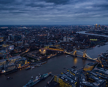 a city with a bridge and a river
