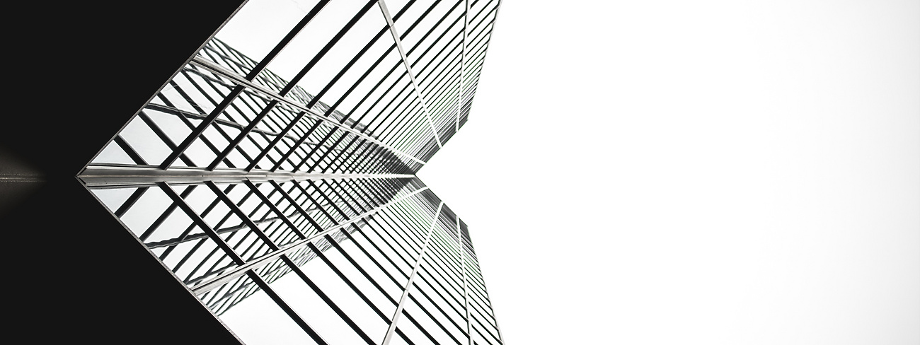 looking up a tall building with windows