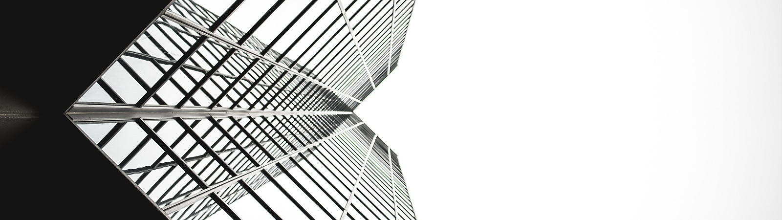 looking up a tall building with windows