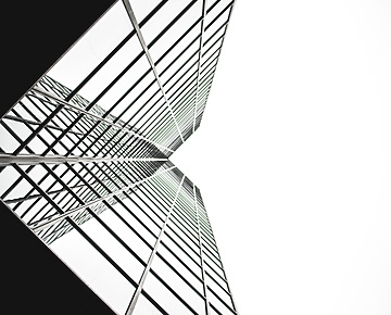 looking up a tall building with windows