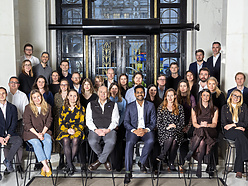 a group of people posing for a photo