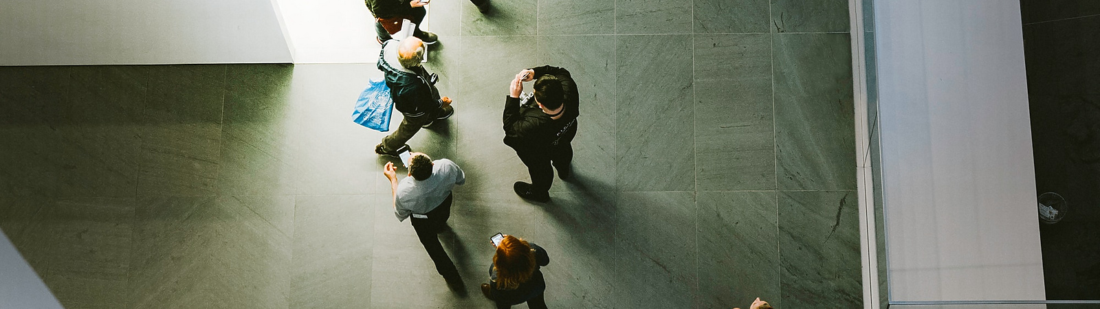 people walking through hall