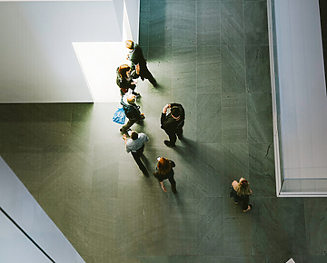 people walking through hall