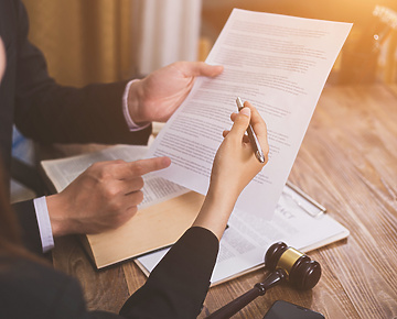 Lawyers reviewing paperwork