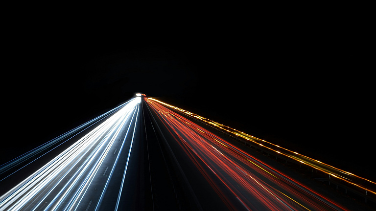 lights shining on black background