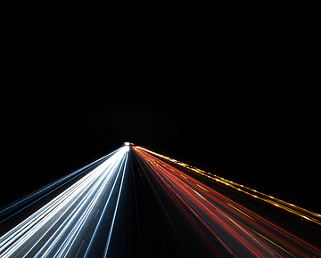 lights shining on black background