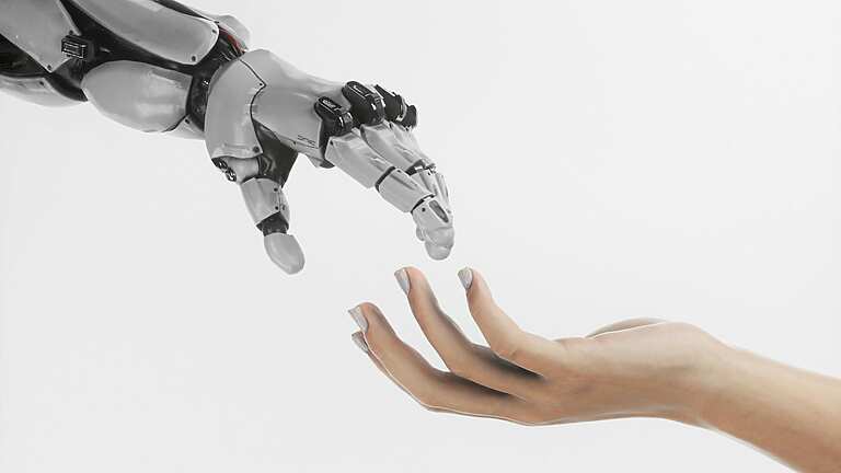 a-hand-reaching-out-towards-a-robot-hand