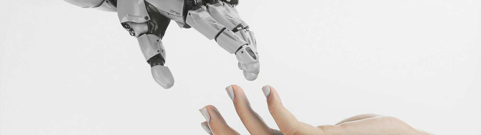 a-hand-reaching-out-towards-a-robot-hand