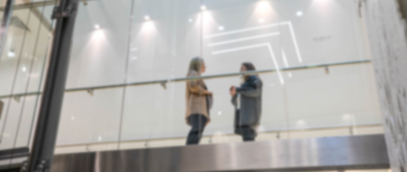 a group of people standing on a balcony