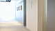 a hallway with a picture on the wall