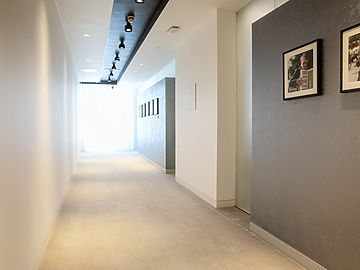 a hallway with a picture on the wall