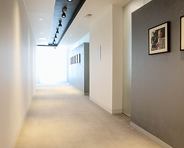 a hallway with a picture on the wall