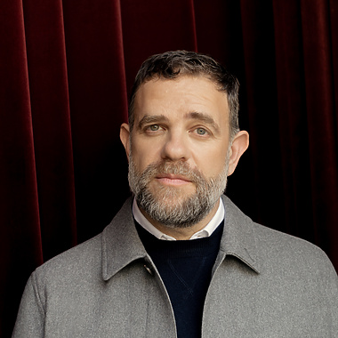 a person in a grey jacket