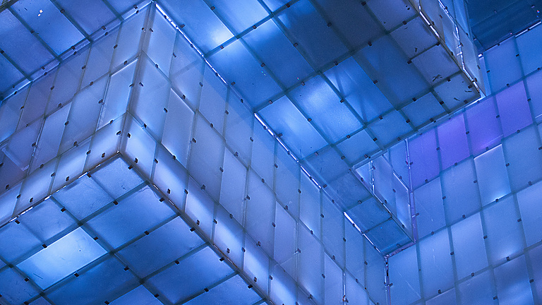 a blue and white building with persony square blocks