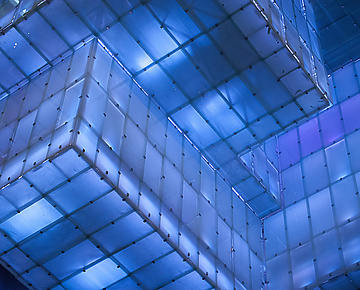 a blue and white building with persony square blocks